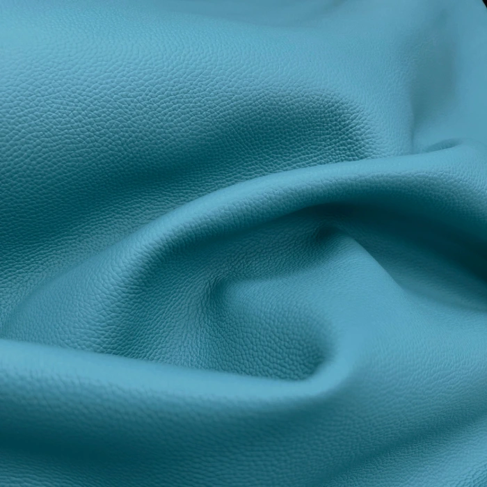 Light blue leather with folds and an engraved pattern