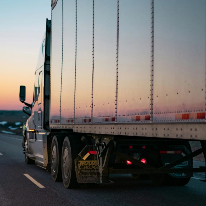 Silver delivery truck on road